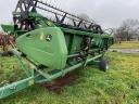 John Deere W650 combine harvester with grain table, with transport wagon