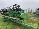 John Deere W650 combine harvester with grain table, with transport wagon